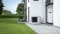 The picture shows the Viessmann Vitocal 200-G heat pump in front of a house wall.