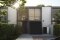 The picture shows a Viessmann Vitocal heat pump in front of a modern residential building.